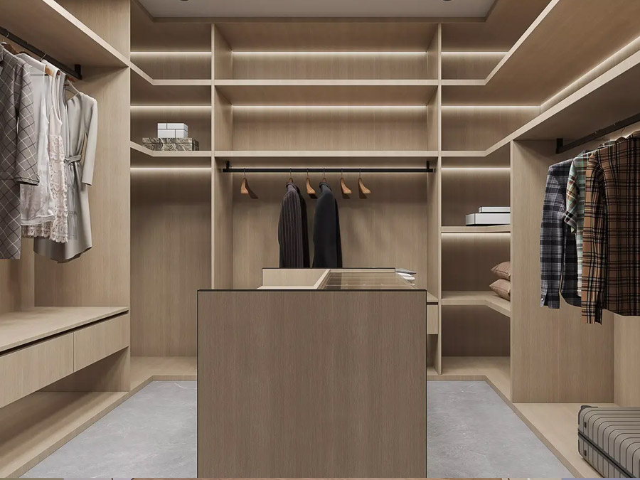 Diseño de un vestidor con isla que cuenta con almacenamiento integrado central